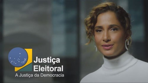 Imagem da campanha mais mulheres na política, fundo desfocado, a marca da justiça eleitoral à es...